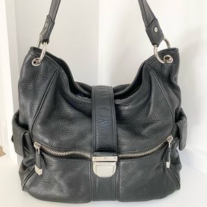 Michael Kors pebbled black leather shoulder bag.